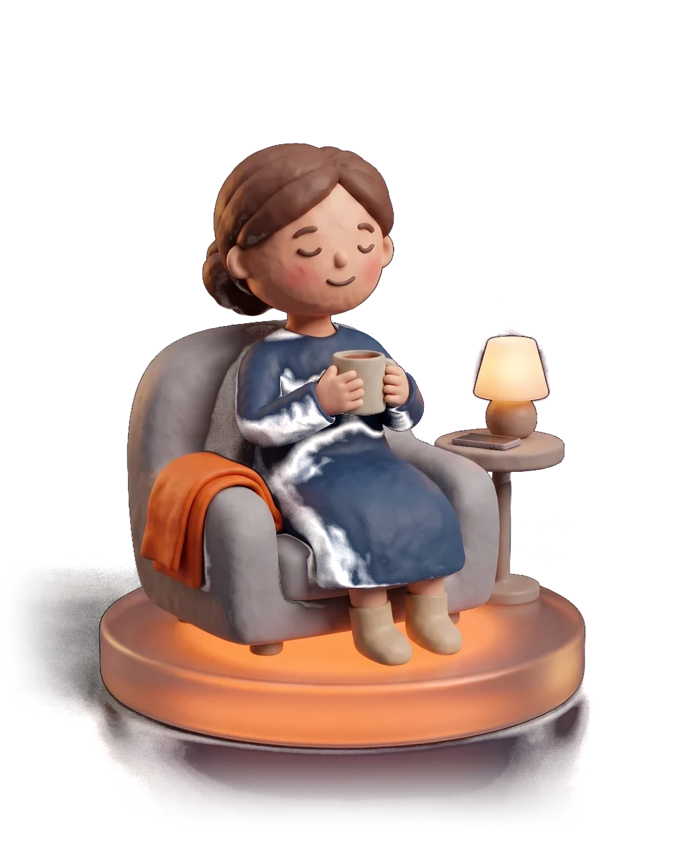 A relaxed small business owner in her armchair in the evening, holding a cup of tea, her phone face down beside her.